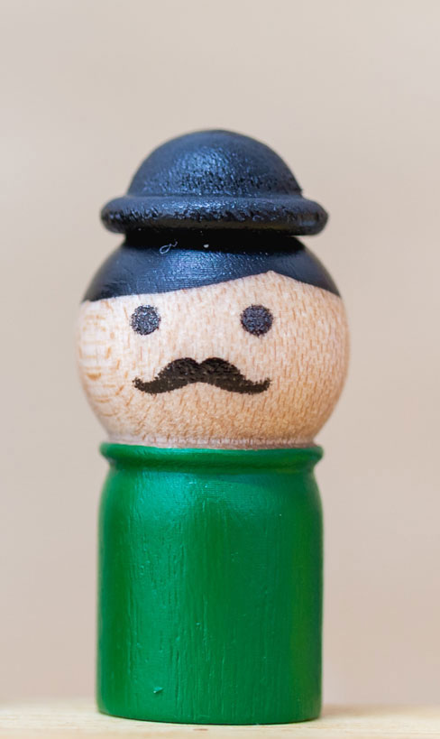 Ron-2 Wooden toy mail with mustache.